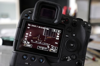 Close-up of camera LCD showing exposure settings during a lesson.