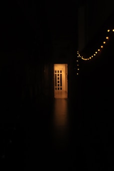 An inviting open door with warm light spilling out, hinting at new beginnings.