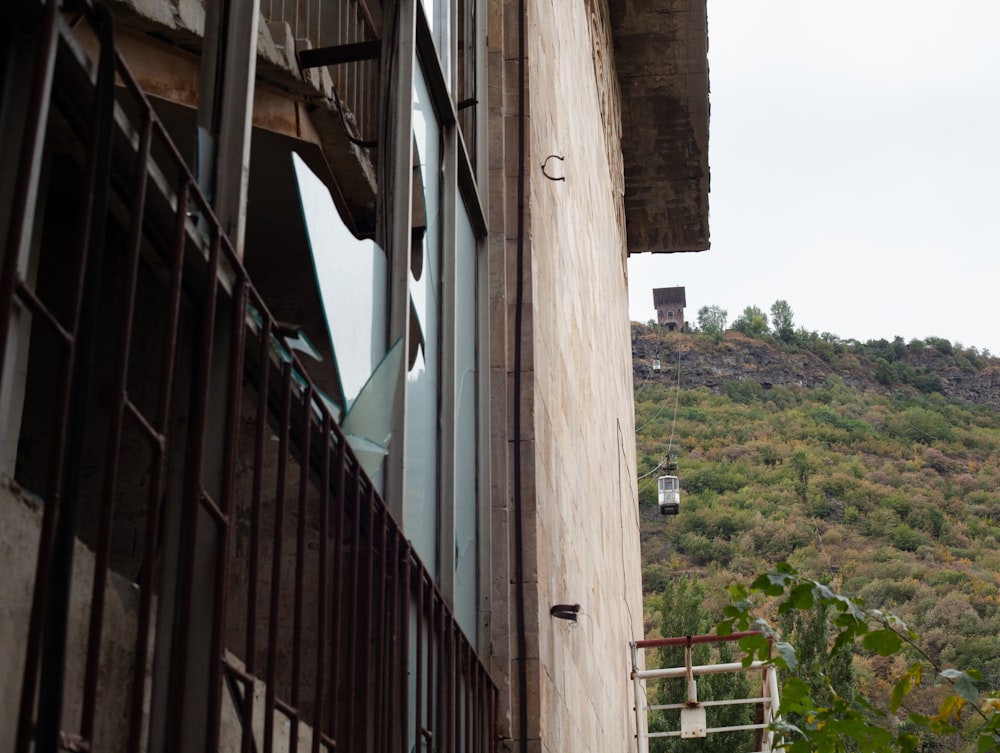 a view of a hill from a window of a building