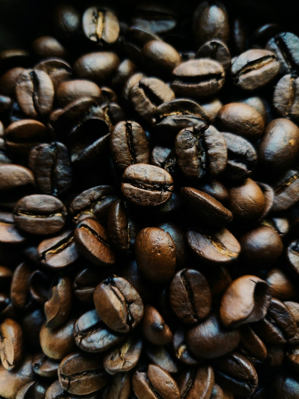 a pile of coffee beans sitting on top of each other