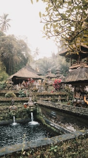 a small pond with a waterfall in the middle of it