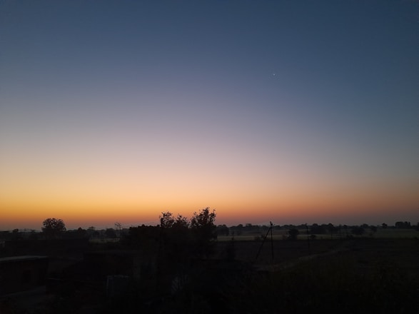 A serene sunrise over a digital landscape symbolizing new beginnings in AI technology.