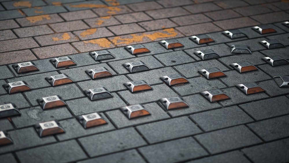 a close up of a street with a bunch of metal objects on it