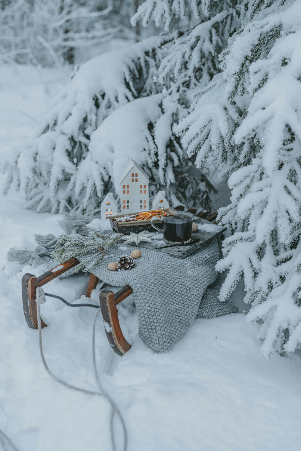 a sled with a house on top of it in the snow