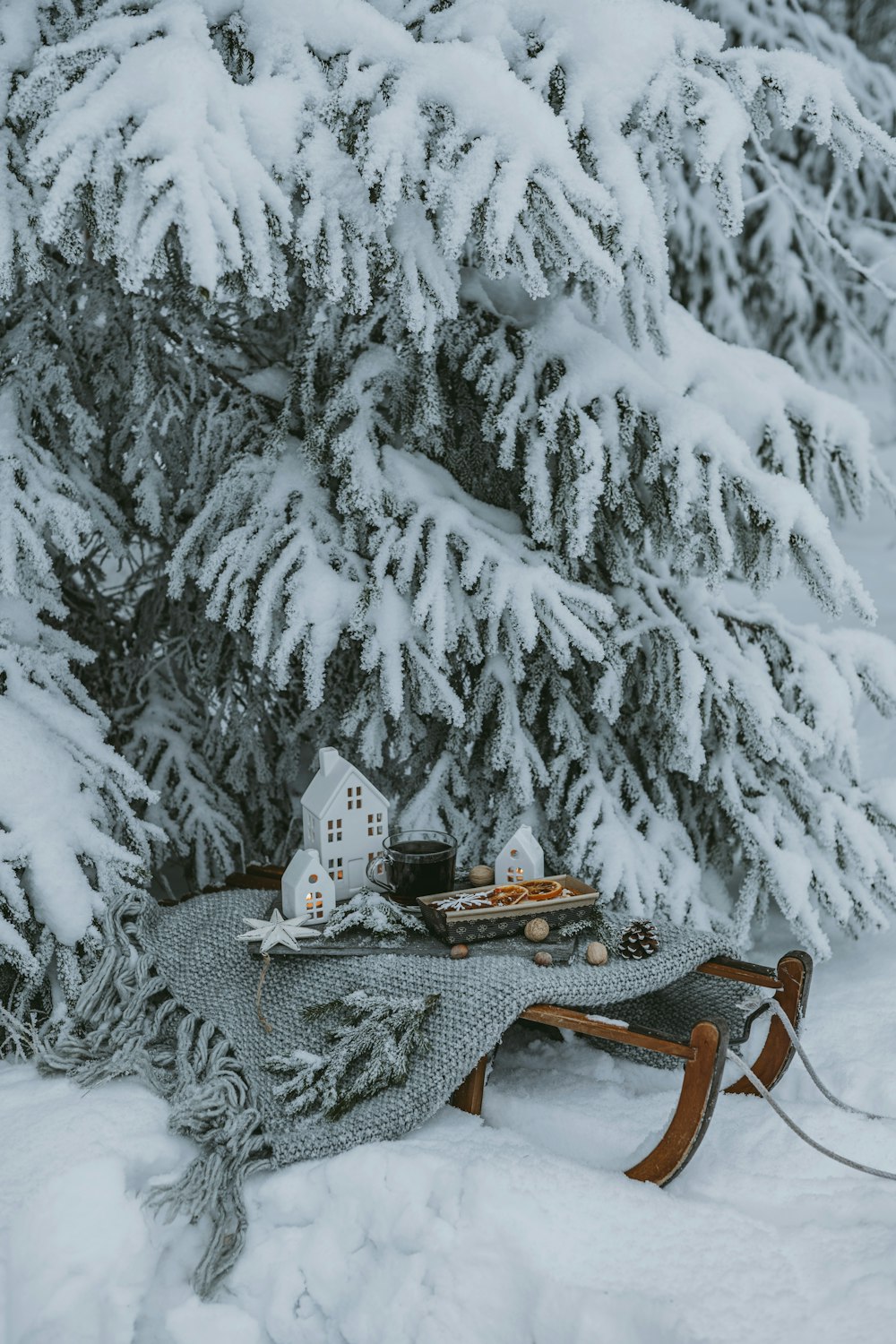 a sled with a house on top of it in the snow