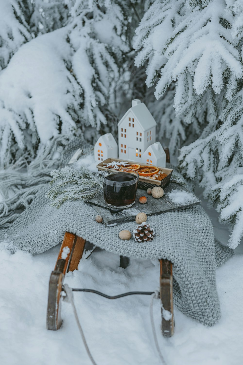 a sled with a cup of coffee on it in the snow