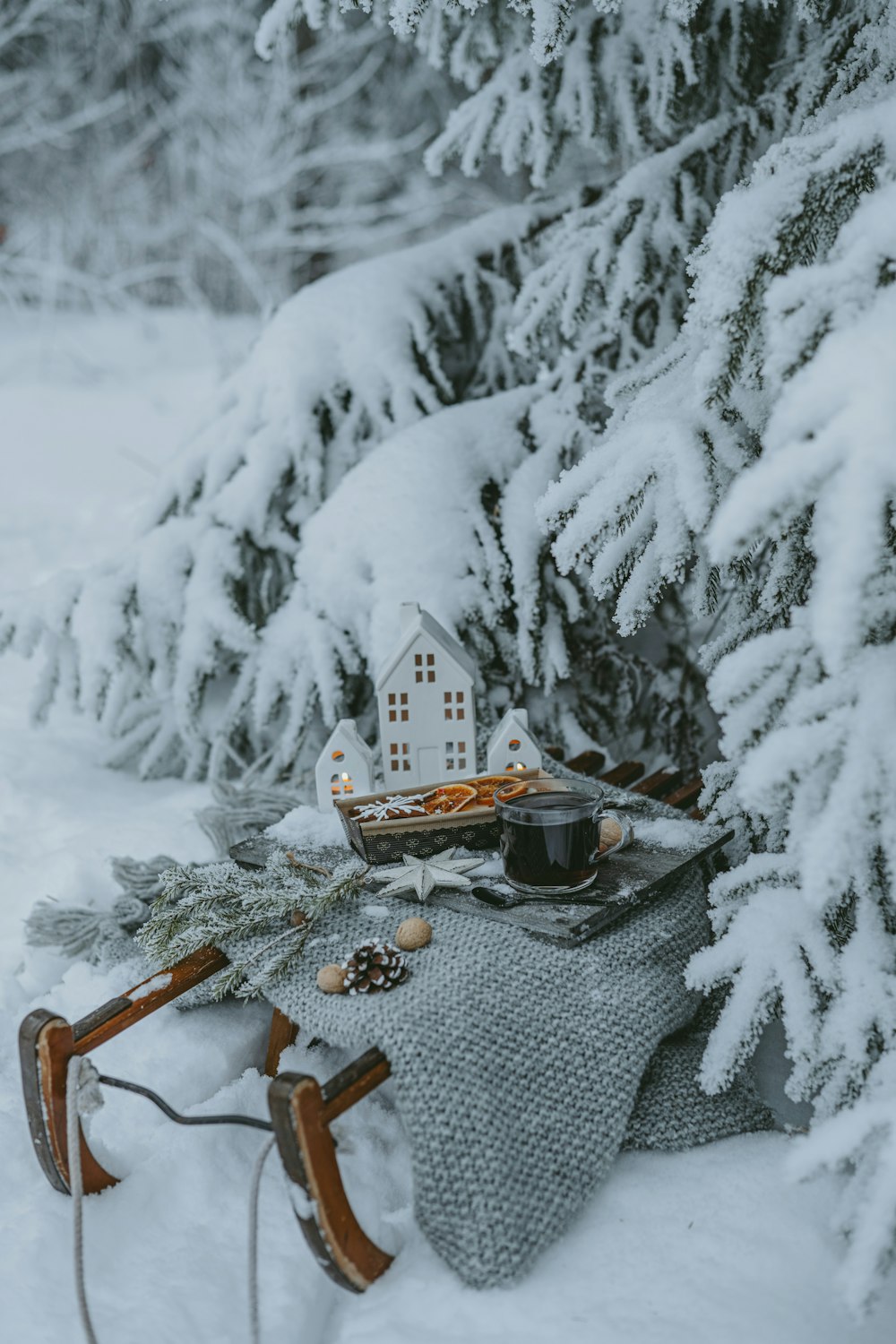 a sled with a house on top of it in the snow