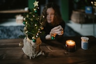 A cozy scene of a family decorating a Christmas tree.
