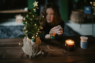 A cozy scene of a family decorating a Christmas tree.