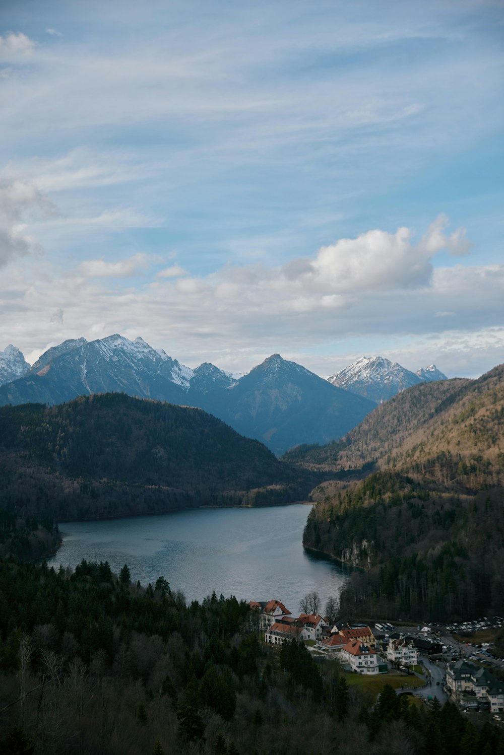 a scenic view of a lake surrounded by mountains