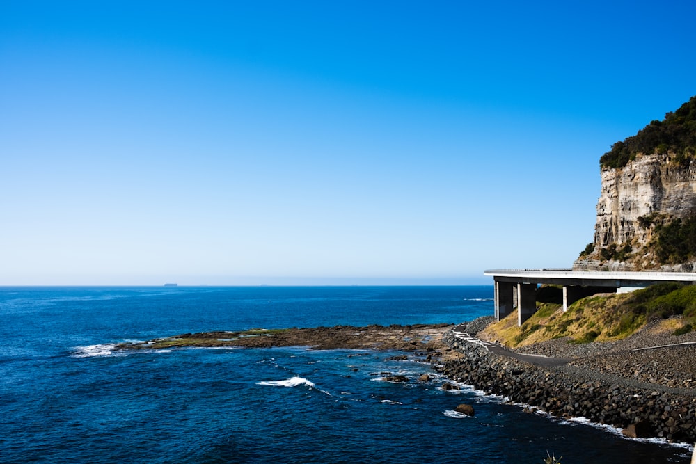 a scenic view of the ocean and a highway