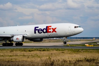 a fed ex airplane is on the runway