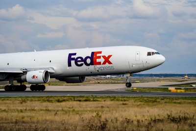 a fed ex airplane is on the runway