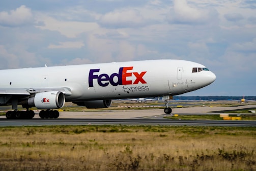 a fed ex airplane is on the runway