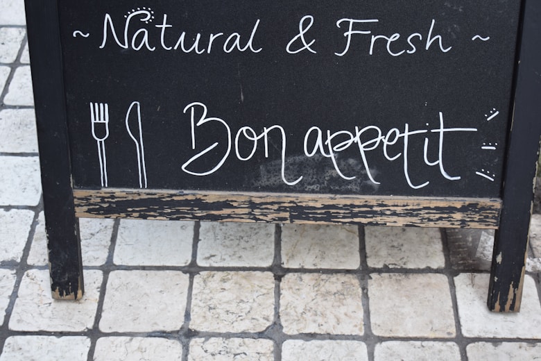 A colorful chalkboard menu displaying daily specials with fresh ingredients beautifully arranged nearby