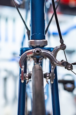 Close-up of shiny brake pads stacked neatly on a blue background