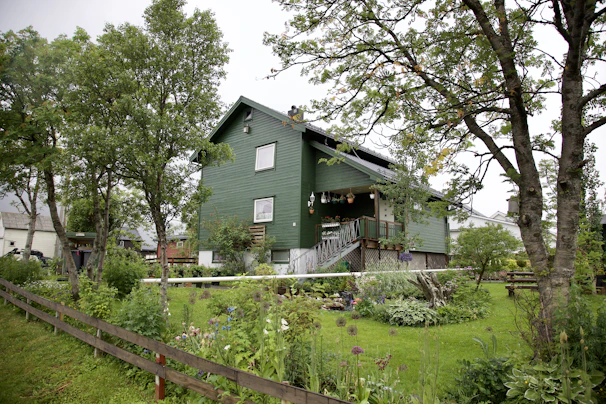 Cozy residential house surrounded by lush greenery and a well-kept garden