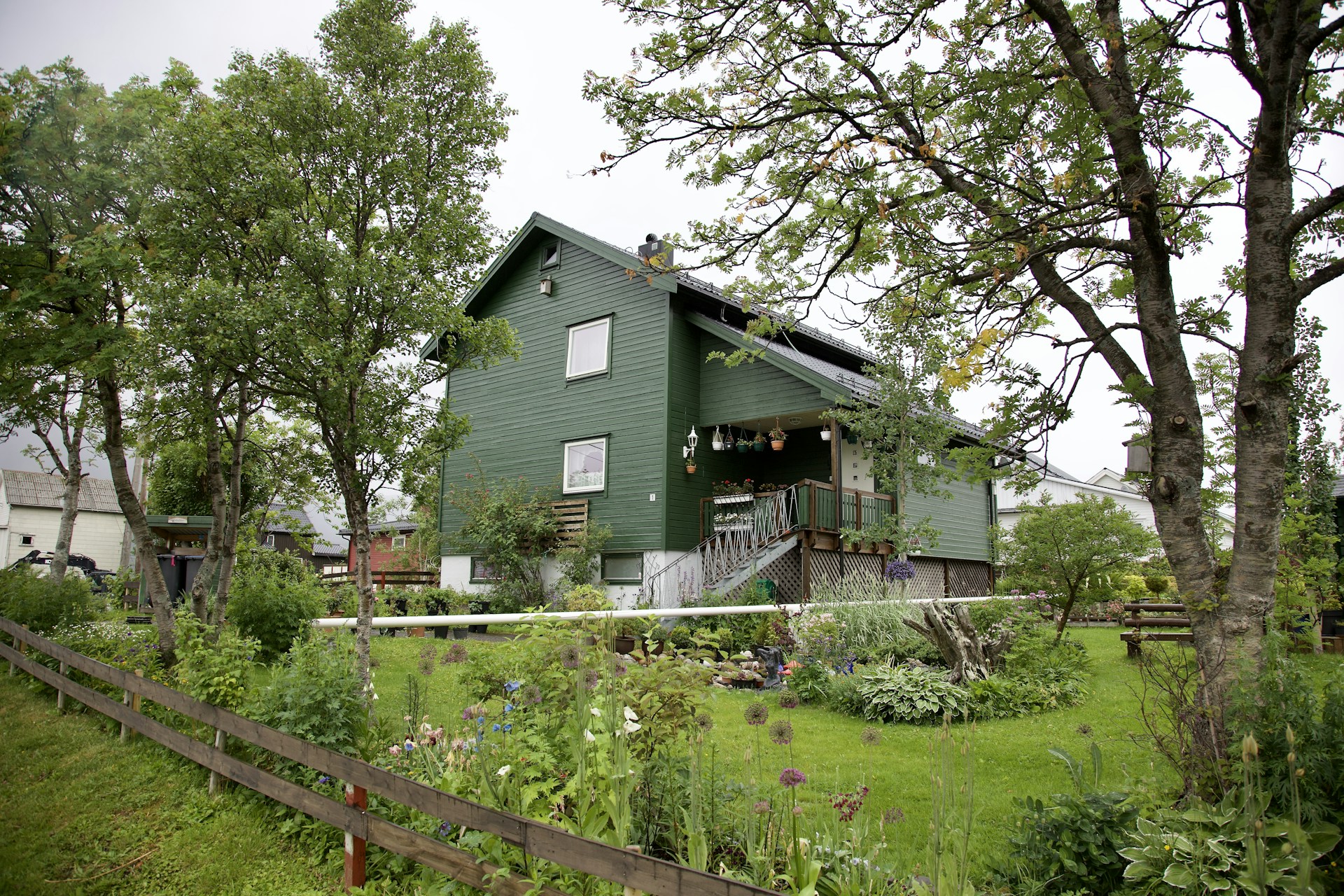 woman wearing yellow long-sleeved dress under white clouds and blue sky during daytime