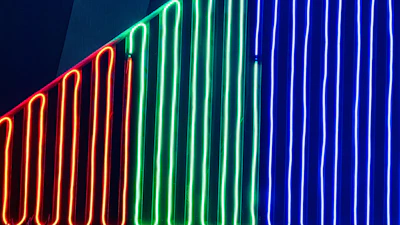 A vibrant red neon-lit streamer setup with black background and glowing graphics.