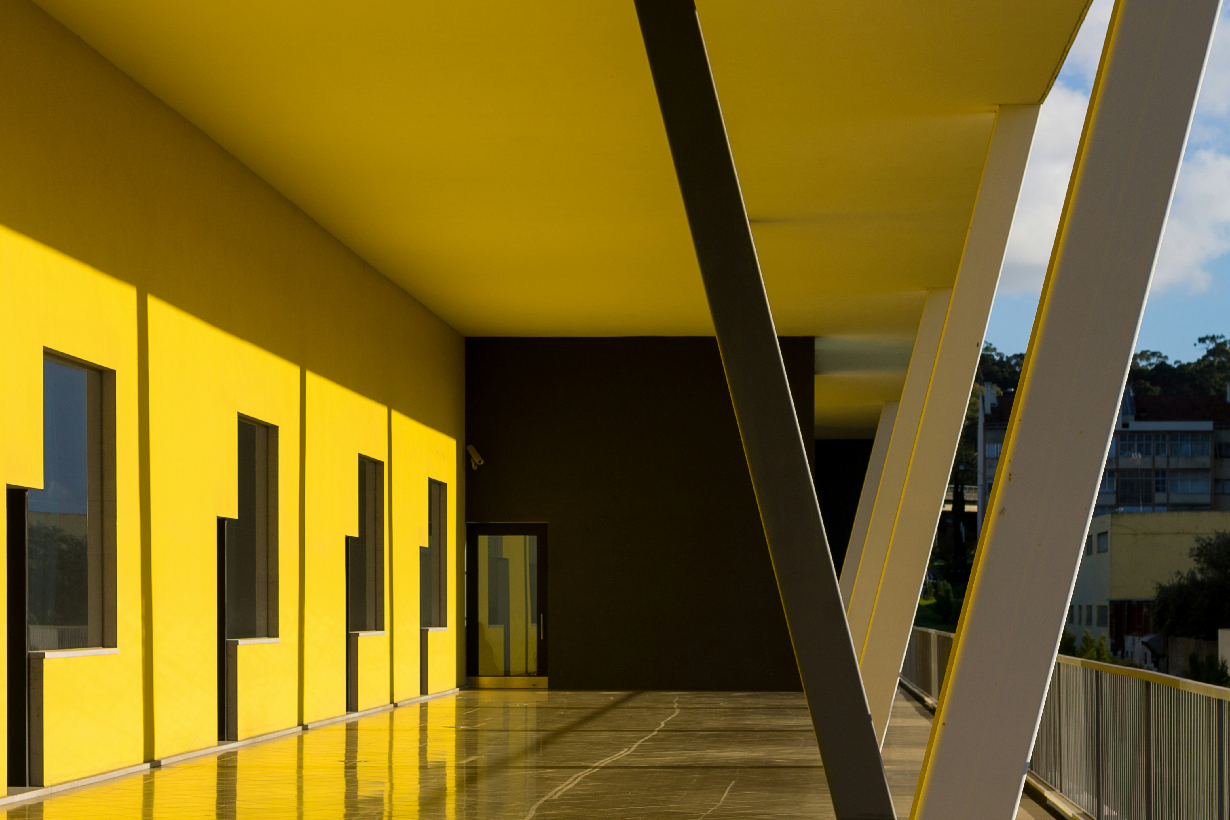 Modern workspace with yellow pillars