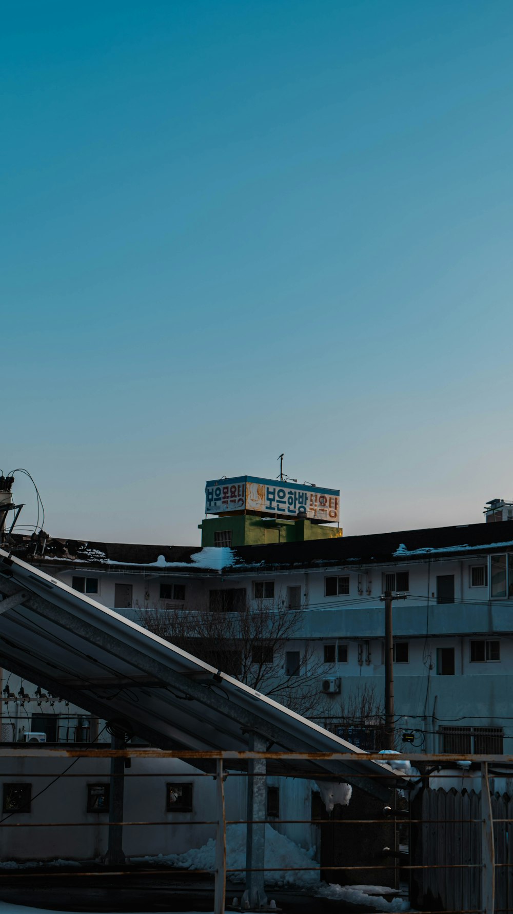 a tall building with a sign on top of it