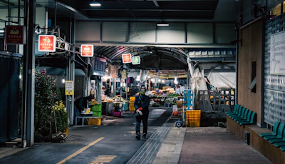 Warm, inviting scene of a modern food market with customers browsing fresh goods.