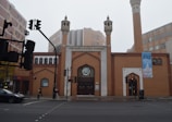a large brick building with two tall towers