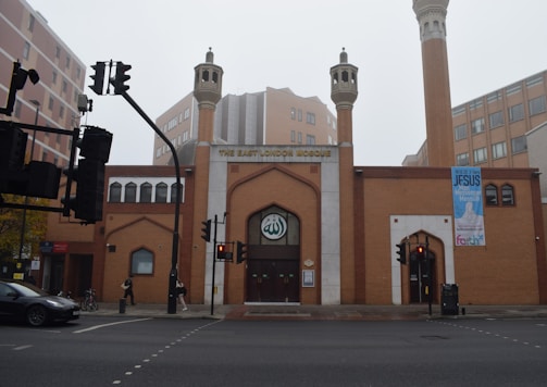 a large brick building with two tall towers
