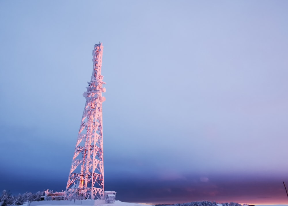 a very tall tower with a lot of lights on top of it