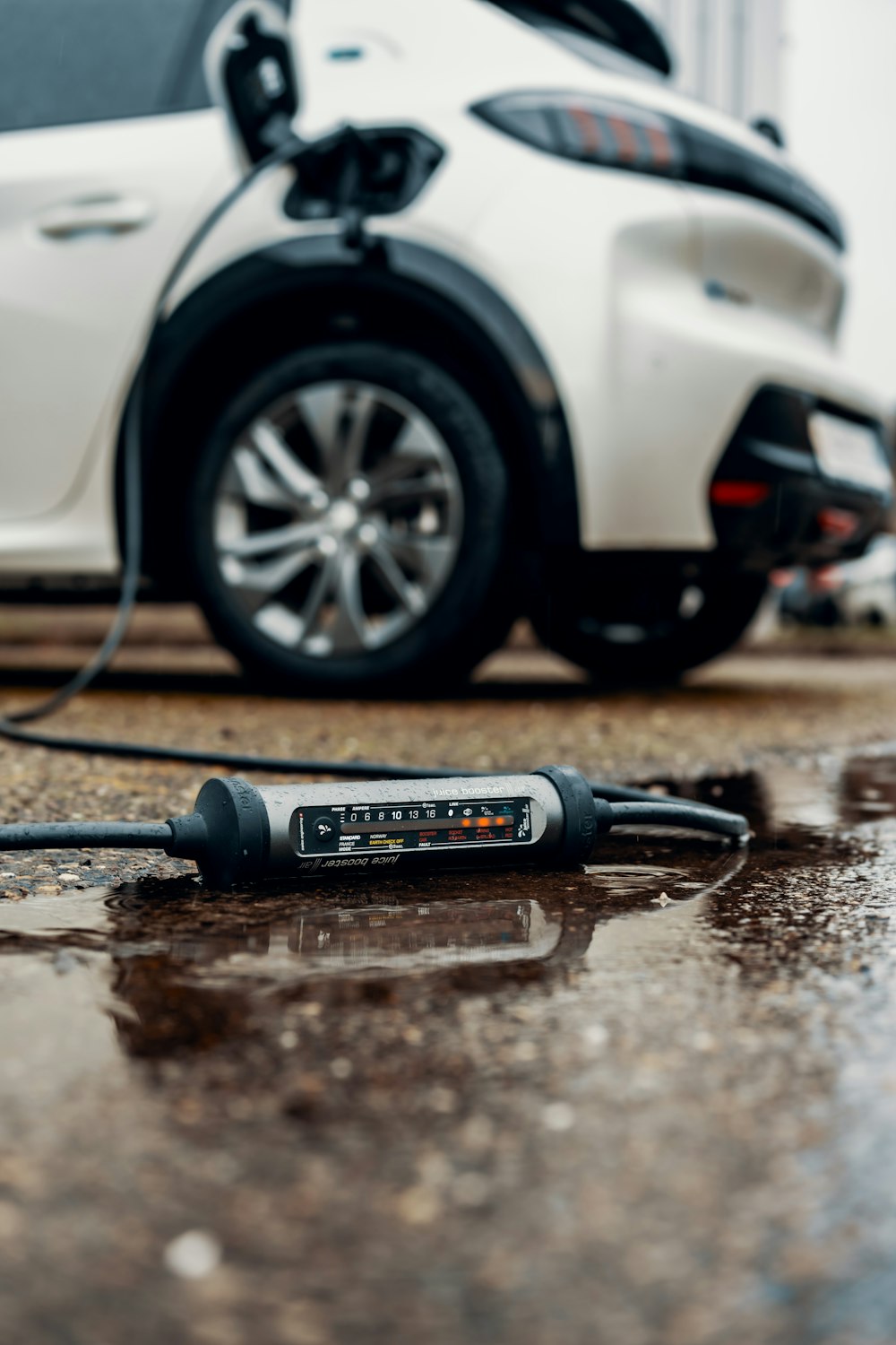 an electric car plugged in to a charger