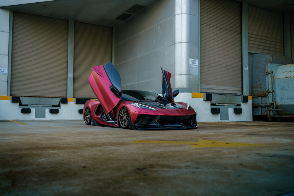 a red sports car parked in a parking lot