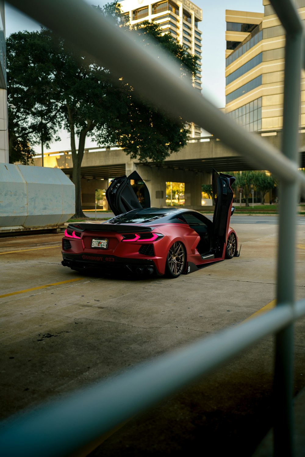 a red sports car parked in a parking lot