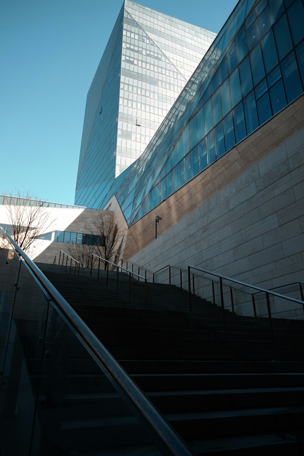 a very tall building sitting next to a set of stairs