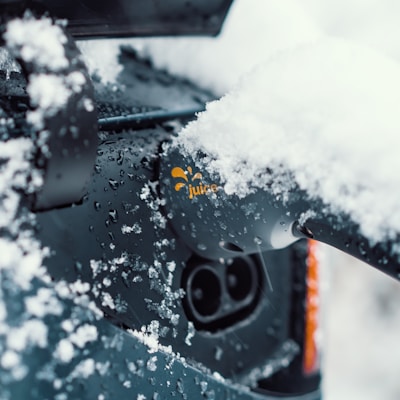 a close up of a car with snow on the windshield