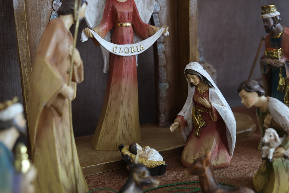a nativity scene with figurines of the birth of jesus