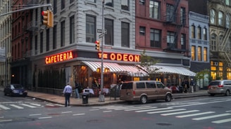 a street corner with a restaurant called the oden