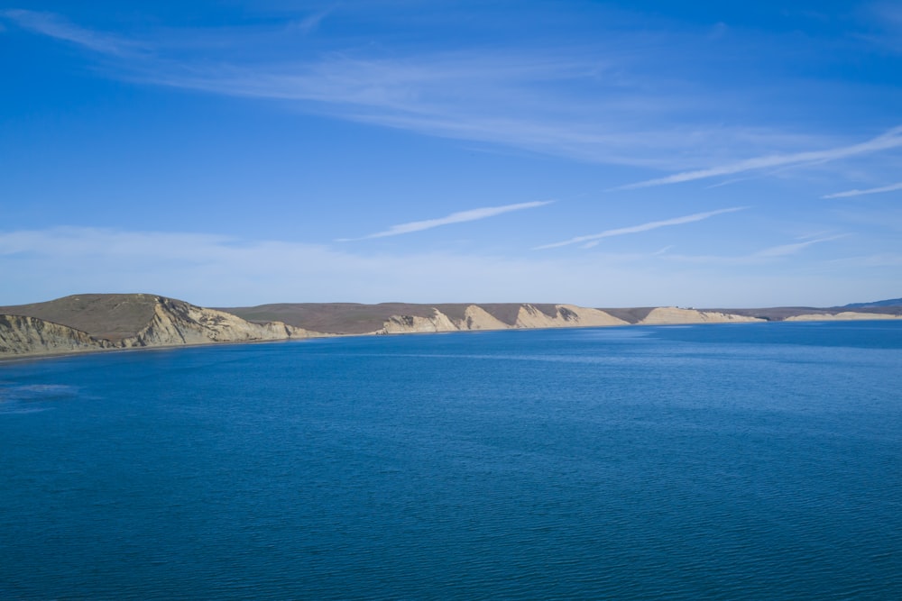 a large body of water surrounded by mountains