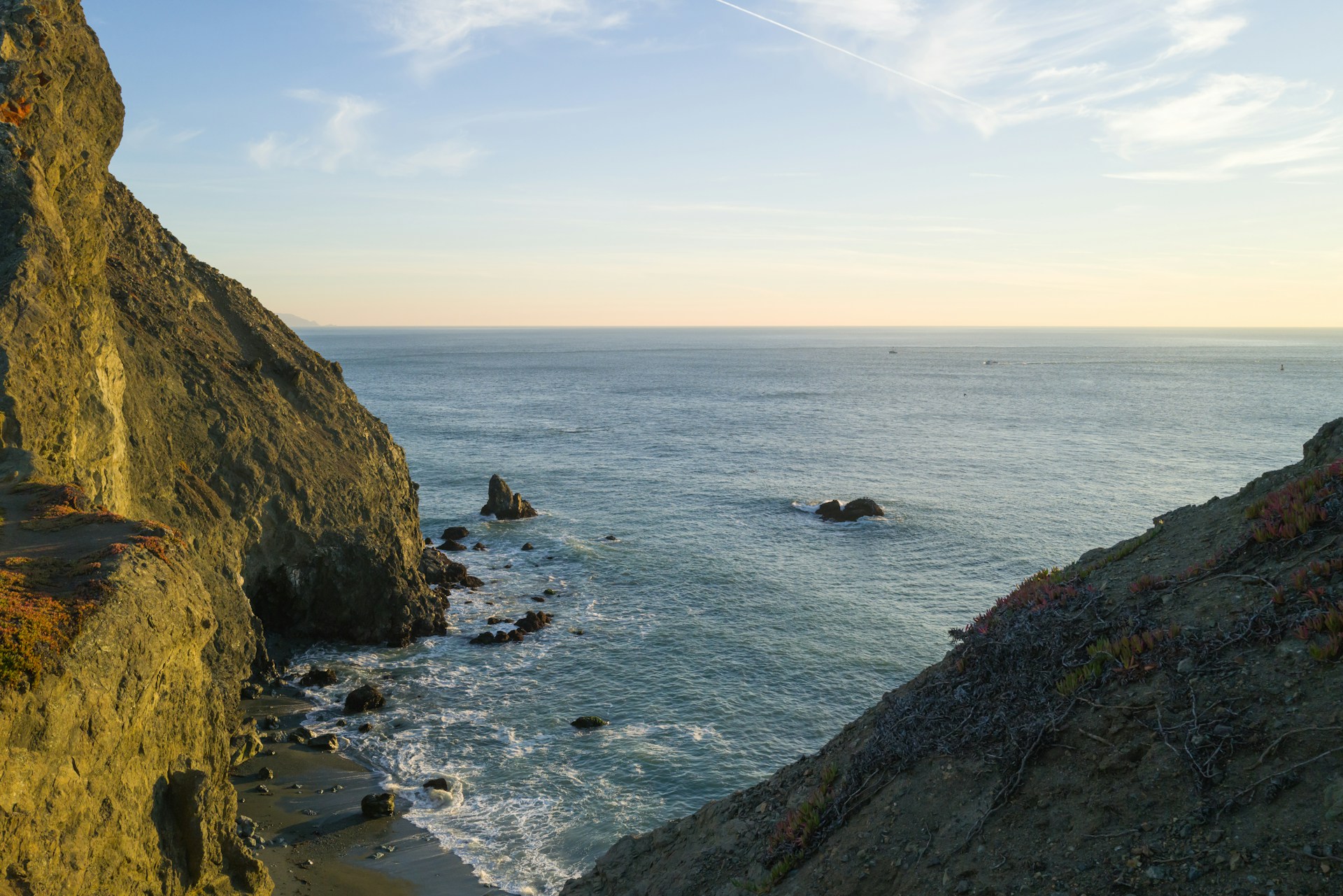 a view of the ocean from a cliff
