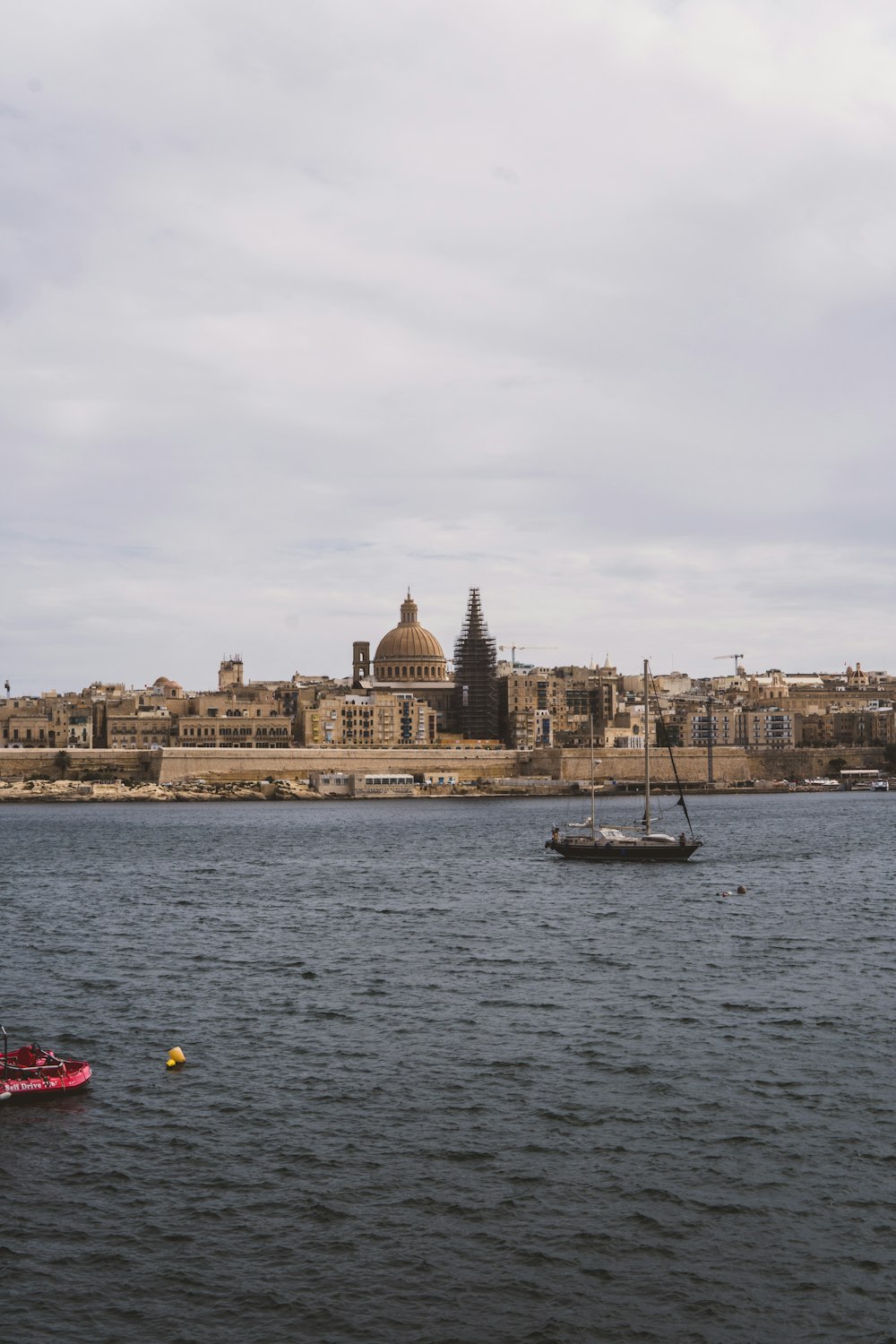 a small boat in a large body of water