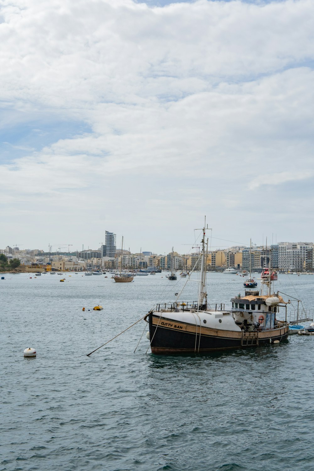 a boat floating on top of a large body of water