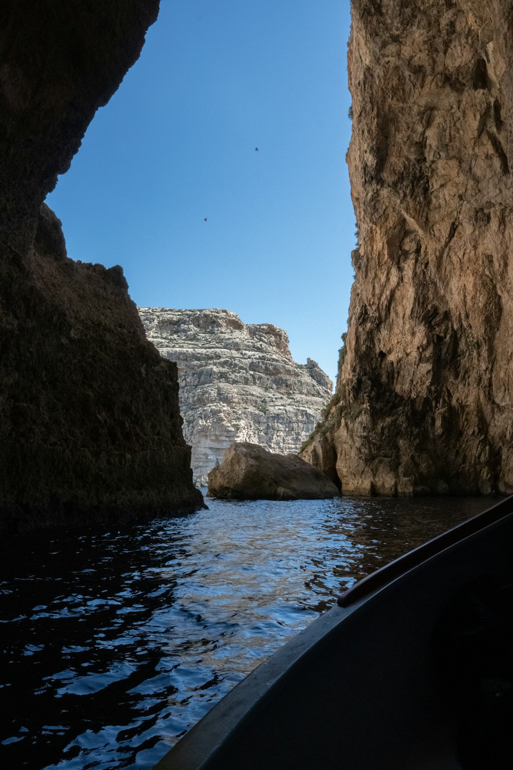 a view of the inside of a cave from a boat