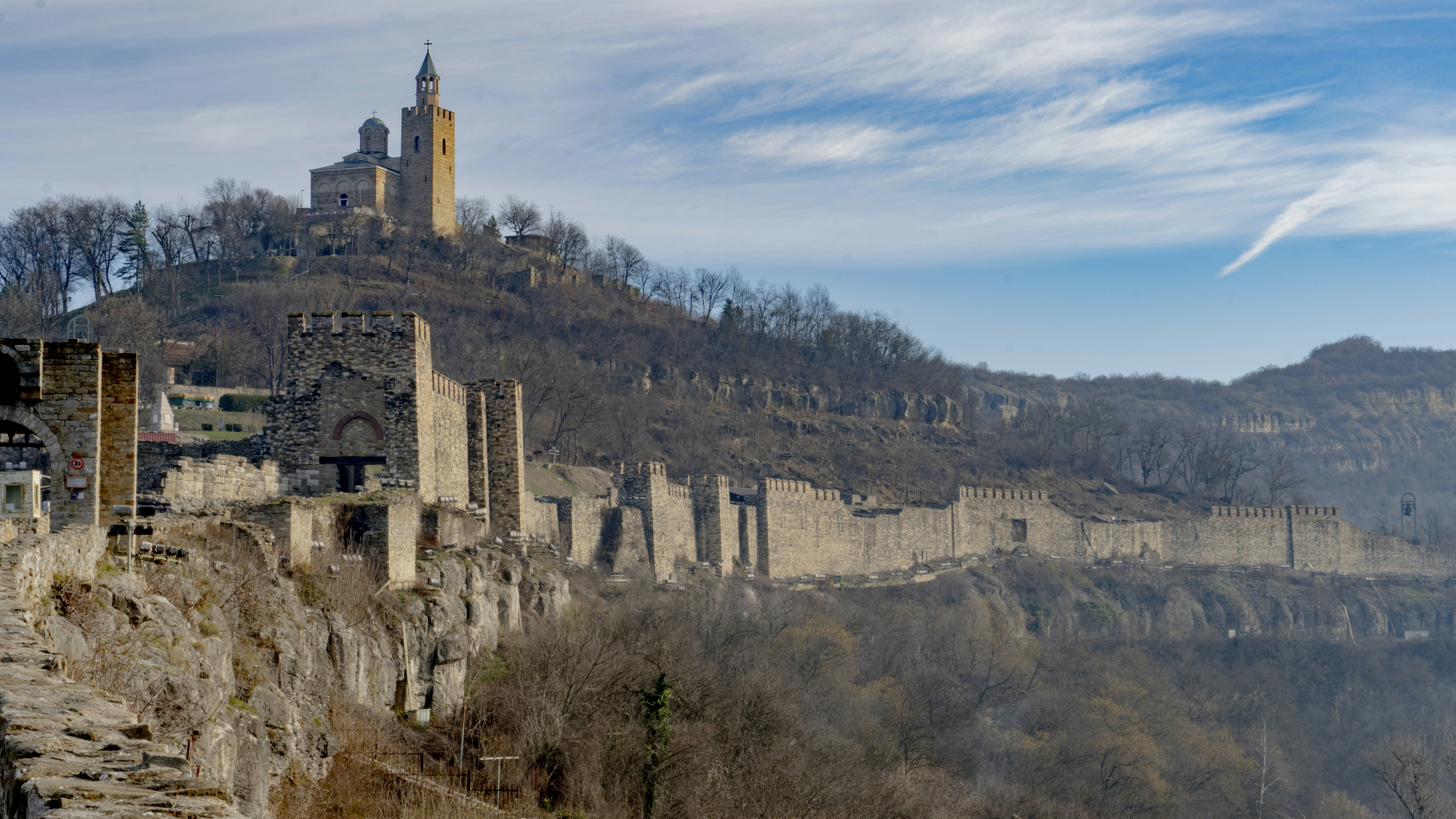 a castle on top of a mountain with a sky background, 
