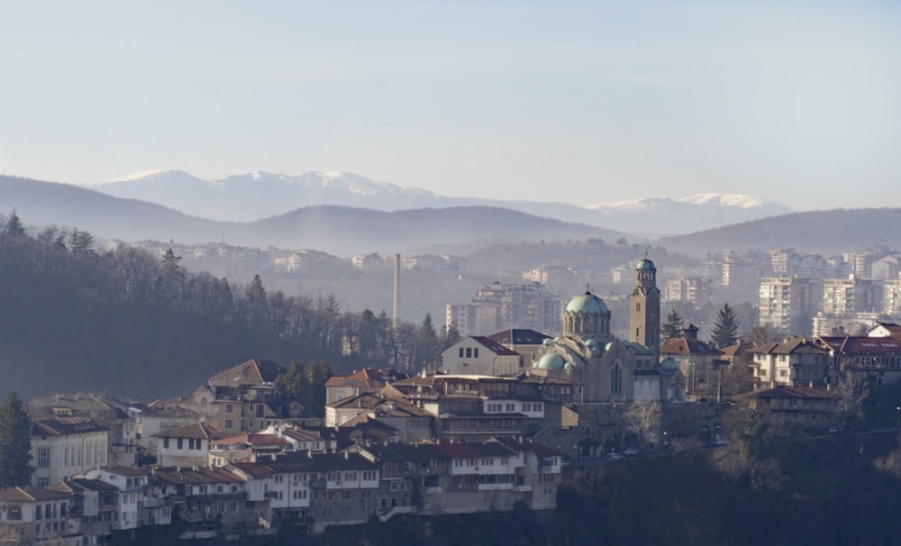 a view of a city with mountains in the background