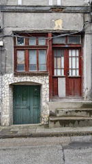 Old building with a door frame that is uneven and irregular.
