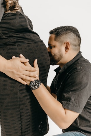 a man and a woman who are touching each other