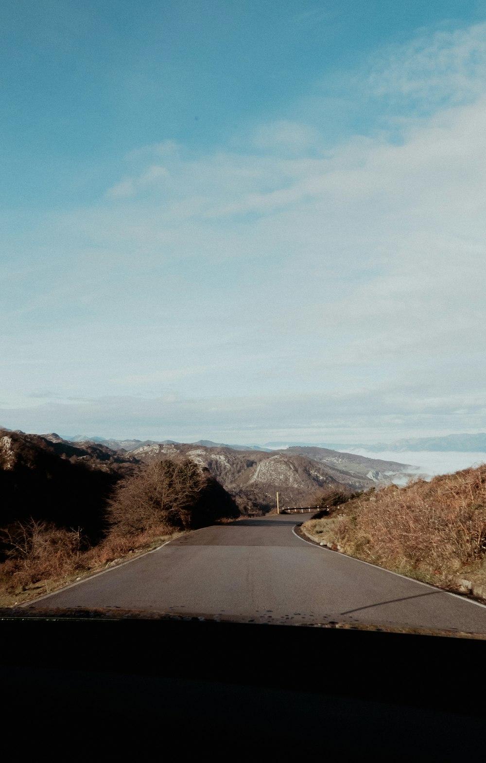 a view of the road from inside a car