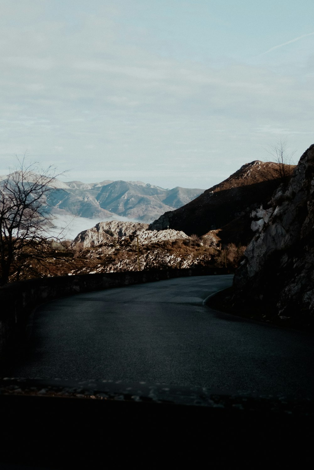 a winding road in the middle of a mountain range