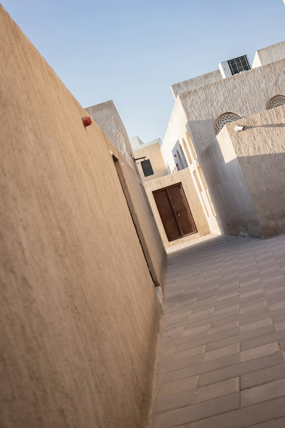 a view of a narrow street with a building in the background