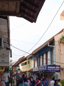 A cheerful traveler exploring a vibrant Indian market street, surrounded by colorful shops and friendly locals.