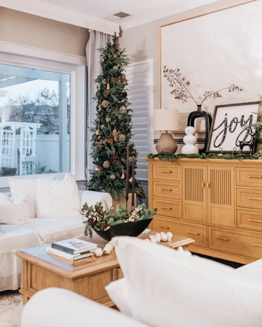 A cozy living room adorned with holiday decorations.